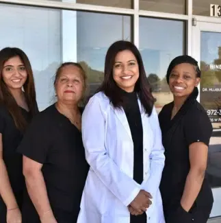 Dr. Shaik and the Shine & Sparkle Dentistry team outside the Plano office